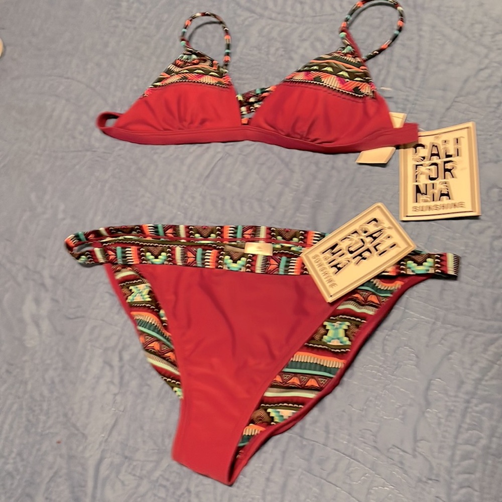 Bikini plum colored large top ex large bottoms. Made by, California sunshine.